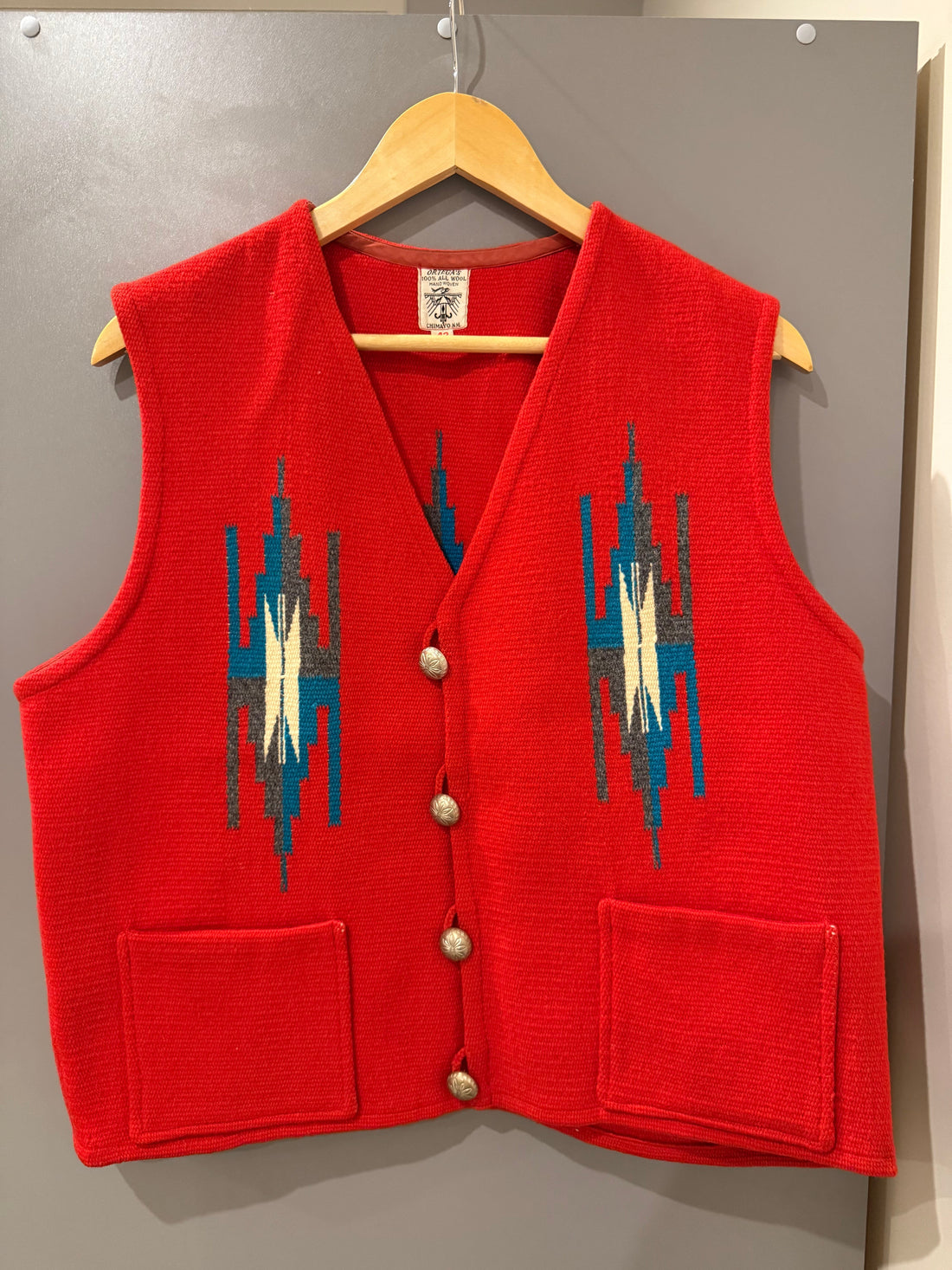Ortega's Chimayo hand-woven wool vest, front, on hanger